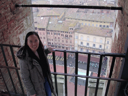 Miaomiao`s friend at the top of the Tower of Mangia, with a view on the Piazza del Campo square with the Gaia Fountain and the Loggia della Mercanzia building