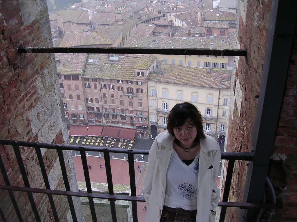 Miaomiao at the top of the Tower of Mangia, with a view on the Piazza del Campo square with the Loggia della Mercanzia building