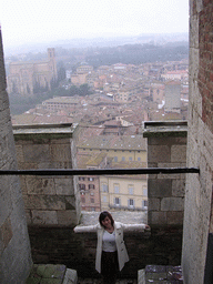 Miaomiao at the top of the Tower of Mangia, with a view on the city center with the Basilica Cateriniana San Domenico church
