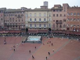 The Piazza del Campo square with the Gaia Fountain and the Loggia della Mercanzia building, viewed from the roof of the Pubblico Palace