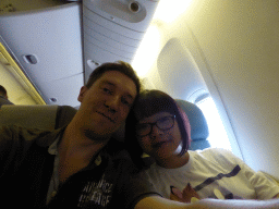 Tim and Miaomiao in the airplane from Amsterdam