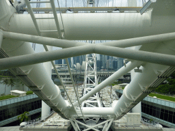 Capsules at the lower half of the Singapore Flyer ferris wheel, with a view on the ArtScience Museum and skyscrapers at the Central Business District