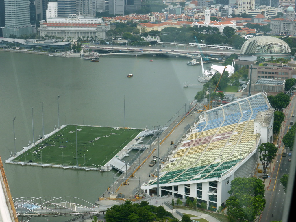 The Marina bay, the Float at Marina Bay stadium, the Esplanade Theatres on the Bay, the Old Supreme Court Building, the Merlion statue at Merlion Park and the Fullerton Hotel, viewed from the Singapore Flyer ferris wheel