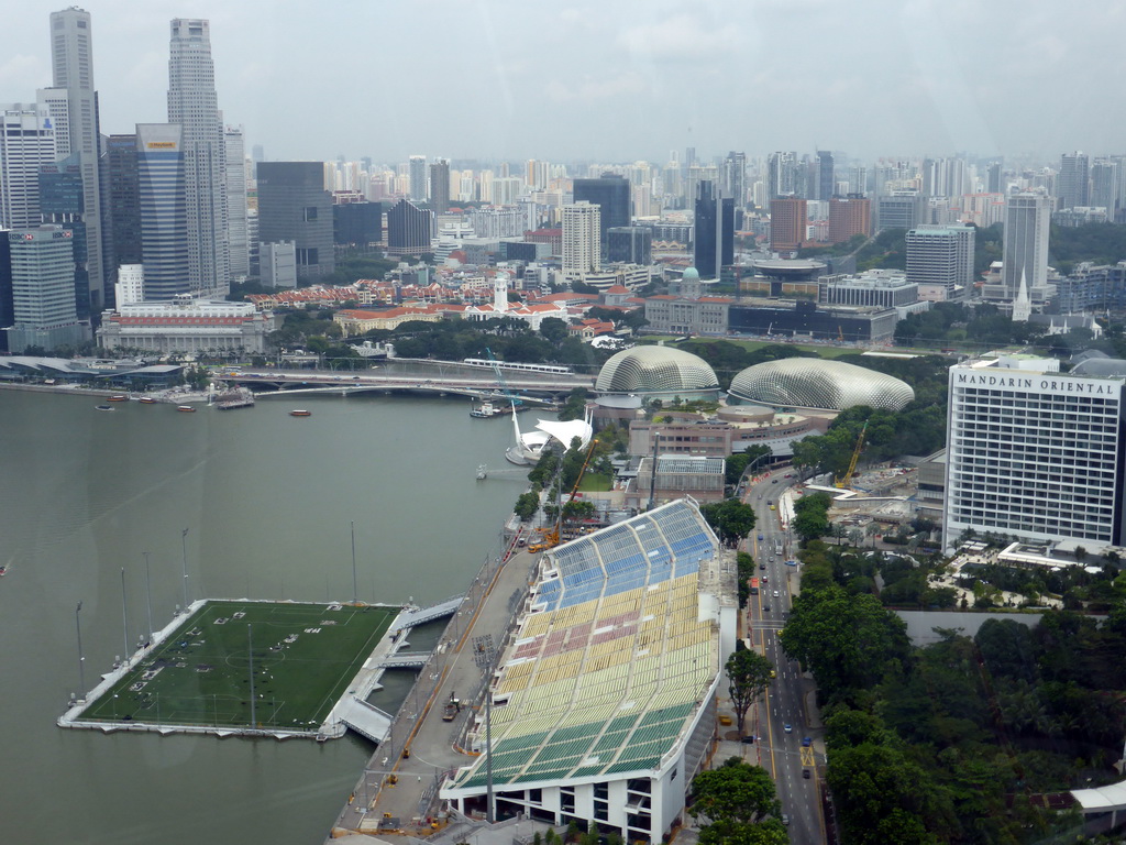 The Marina bay, the Float at Marina Bay stadium, the Esplanade Theatres on the Bay, the Old Supreme Court Building, the Merlion statue at Merlion Park and the Fullerton Hotel, viewed from the Singapore Flyer ferris wheel