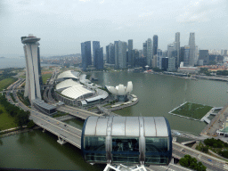 Capsule at the upper half of the Singapore Flyer ferris wheel, with a view on the Marina Bay, the Marina Bay Sands building, the ArtScience Museum, the Float at Marina Bay stadium and skyscrapers at the Central Business District, viewed from the Singapore Flyer ferris wheel
