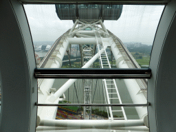 Capsules at the upper half of the Singapore Flyer ferris wheel, with a view on the grandstands of the Singapore Formula 1 Race Track, the New Singapore National Stadium and the Marina Bay Golf Course