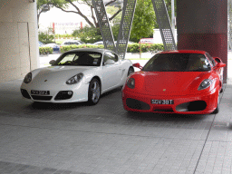A Porsche and a Ferrari parked in front of a building at New Bridge Road