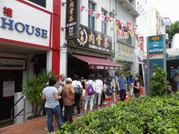People waiting in line in front of the Song Fa Bak Kut Teh restaurant at New Bridge Road