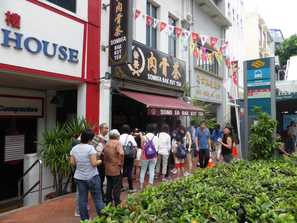 People waiting in line in front of the Song Fa Bak Kut Teh restaurant at New Bridge Road