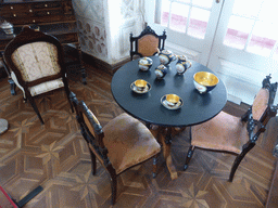 Table with tea set and chairs in a room at the upper floor of the Palácio da Pena palace
