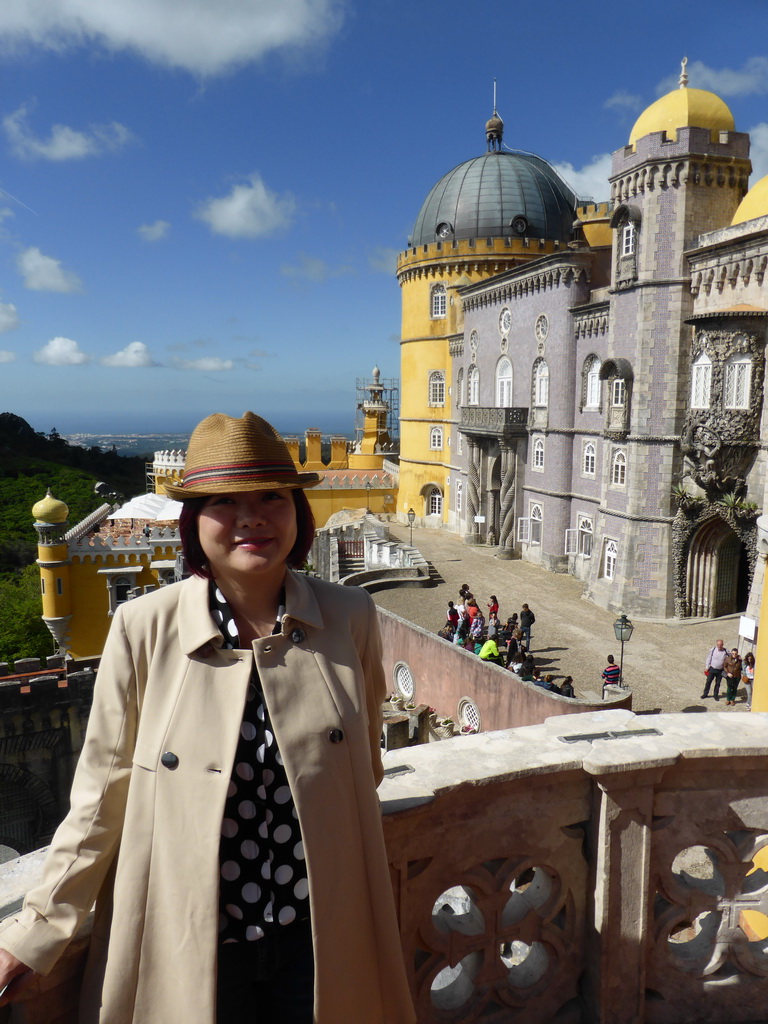 Miaomiao at the Queen`s Terrace, with a view on the southeast side of the Palácio da Pena palace and surroundings