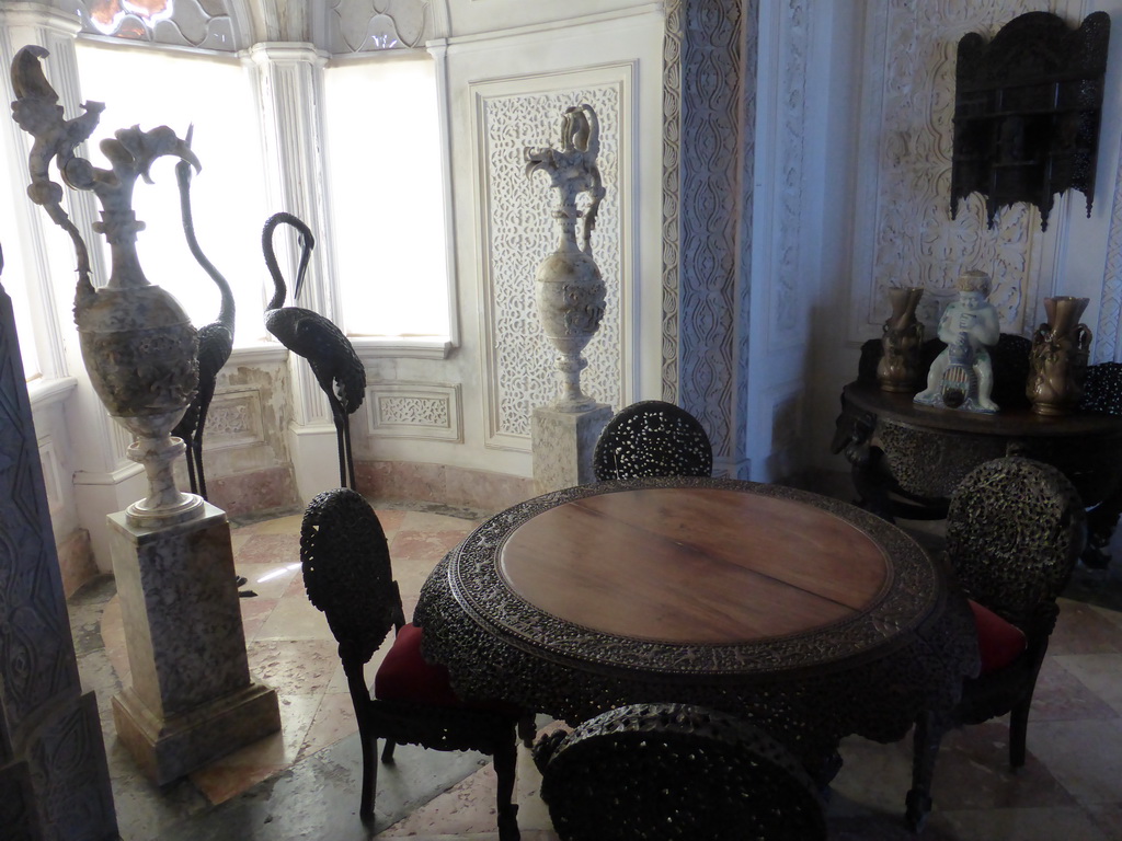 Table, chairs and vases in a room at the upper floor of the Palácio da Pena palace