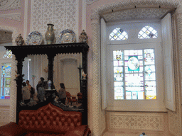 Sofa, mirror and stained glass window at the Ballroom at the upper floor of the Palácio da Pena palace