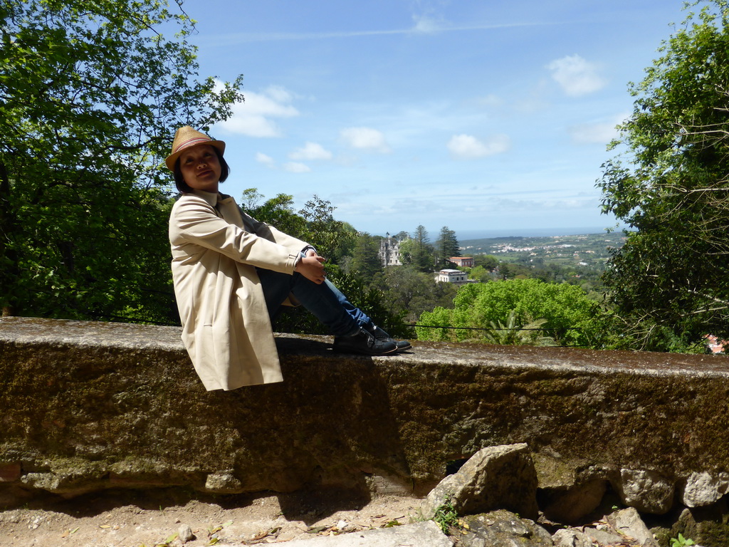 Miaomiao on a wall at the Parque das Merendas park, with a view on the Quinta da Regaleira palace and surroundings