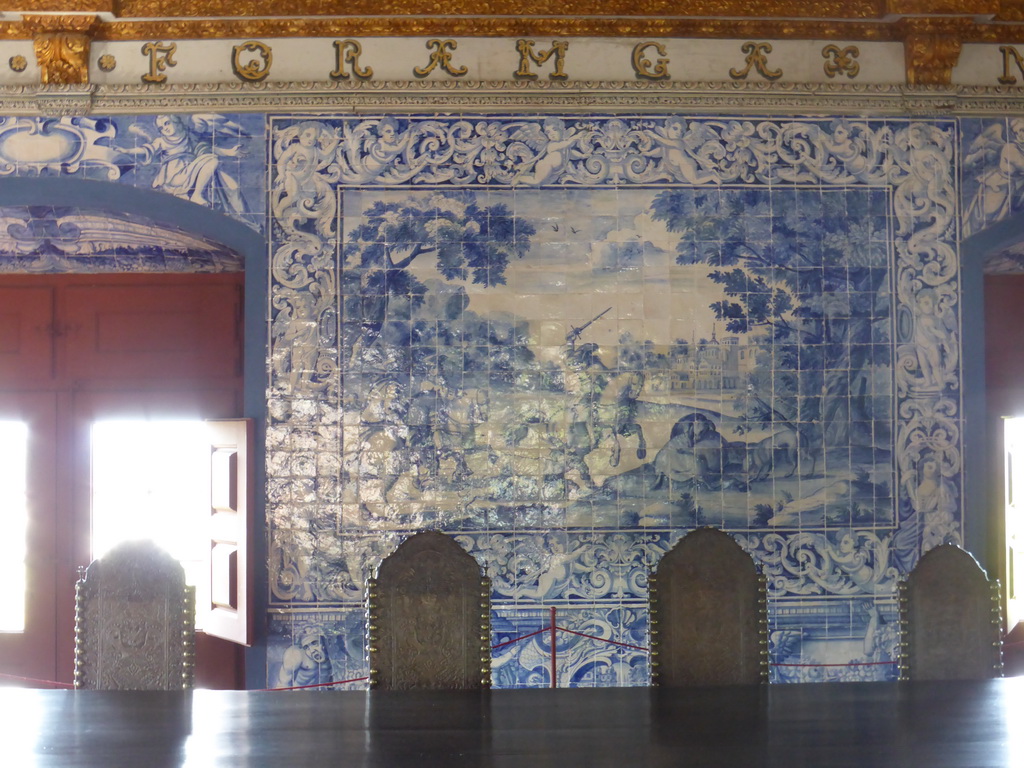 Table, chairs and painted wall tiles at the Blazons Hall at the Palácio Nacional de Sintra palace