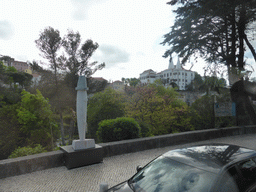 Statue at the Volta Duche street and the Palácio Nacional de Sintra palace, viewed from the bus to the Cabo da Roca cape