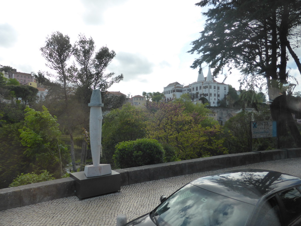 Statue at the Volta Duche street and the Palácio Nacional de Sintra palace, viewed from the bus to the Cabo da Roca cape