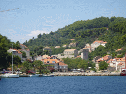 Boats at the Sudurad Harbour and the town of Sudurad, viewed from the Elaphiti Islands tour boat