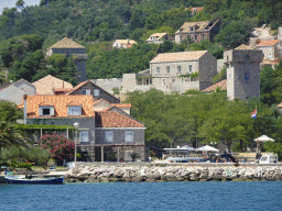 Boats at the Sudurad Harbour and the town of Sudurad with the Skocibuha Summer Residence, viewed from the Elaphiti Islands tour boat