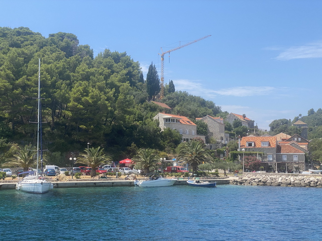 Boats at the Sudurad Harbour and the town of Sudurad, viewed from the Elaphiti Islands tour boat