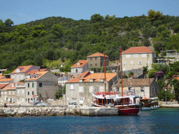 Boats at the Sudurad Harbour and the town of Sudurad, viewed from the Elaphiti Islands tour boat