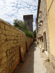 Front of wine and olive oil tasting stores and the tower of the Skocibuha Summer Residence at the town of Sudurad