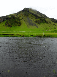 Mountain on the west side of Skógar, and the stream from the Skógafoss waterfall