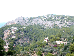 Mountains and houses on the west side of the town, viewed from the rental car on the Ma-10 road