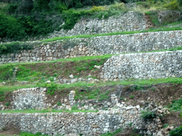 Stone terraces on a hill at the west side of the town, viewed from the rental car on the Ma-10 road