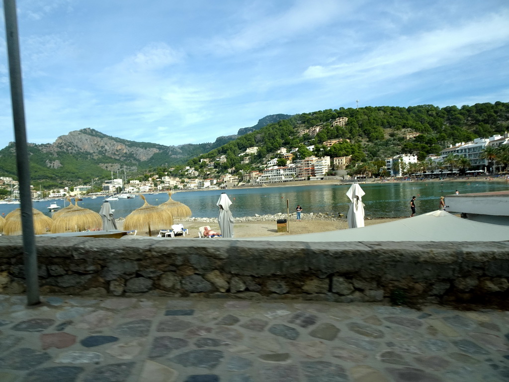 The Platja d`en Repic beach and the harbour, viewed from the rental car on the Camí del Far street