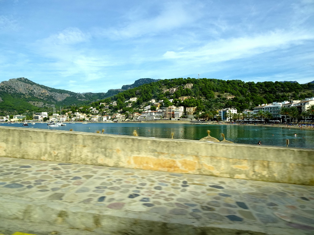 The Platja d`en Repic beach and the harbour, viewed from the rental car on the Camí del Far street