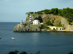 The Faro de Punta de Sa Creu lighthouse, viewed from the rental car on the Camí del Far street