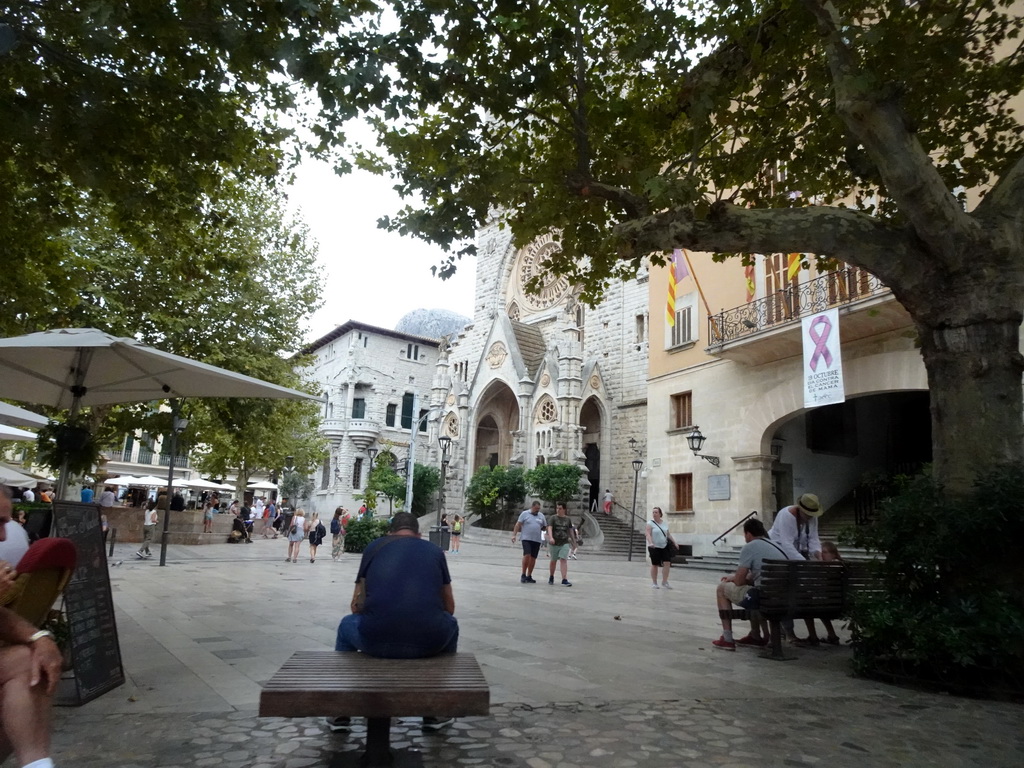 The Plaça Constitucio square with the front of the Església de Sant Bartomeu church, viewed from the rental car