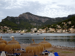 The west side of the Platja d`en Repic beach and boats in the harbour