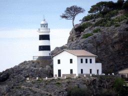The Faro de Punta de Sa Creu lighthouse, viewed from the Platja d`en Repic beach