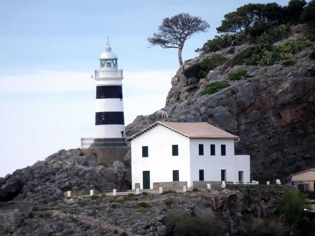 The Faro de Punta de Sa Creu lighthouse, viewed from the Platja d`en Repic beach