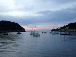 Boats in the harbour, the Far des Cap Gros lighthouse and the Faro de Punta de Sa Creu lighthouse, viewed from the Polígon de Través street, at sunset