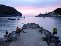 Pier at the east side of the harbour, the Far des Cap Gros lighthouse and the Faro de Punta de Sa Creu lighthouse, at sunset