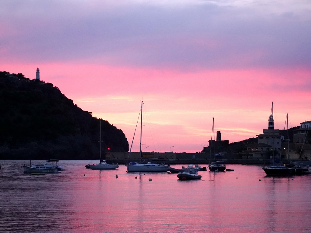 Boats in the harbour, the Far des Cap Gros lighthouse and the Faro de Punta de Sa Creu lighthouse, viewed from the Polígon de Través street, at sunset