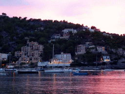 Boats and houses at the west side of the harbour, viewed from the Polígon de Través street, at sunset