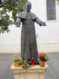 Statue of Pope John Paul II in front of the Cathedral of Saints Philip and James at the Corso Italia street