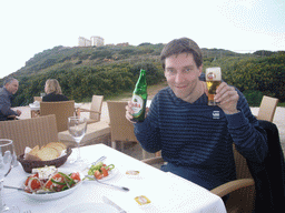 Tim with lunch and the Temple of Poseidon