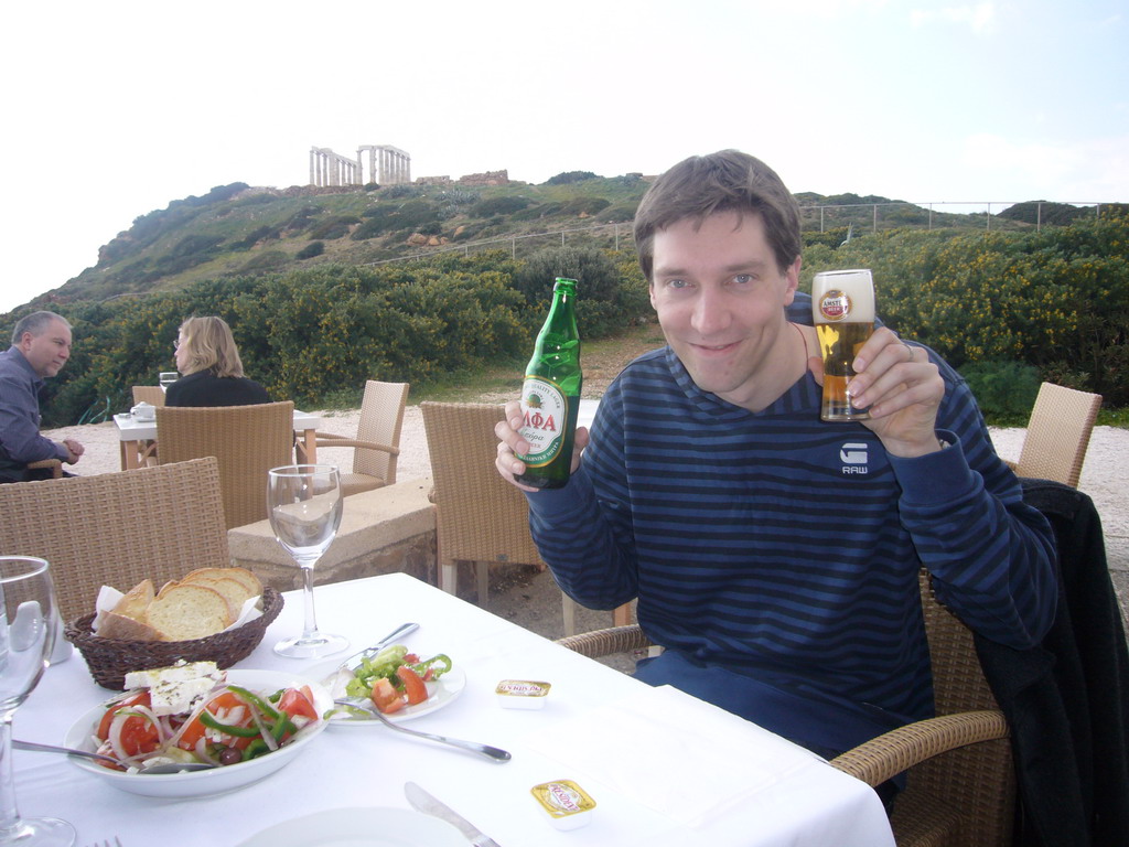 Tim with lunch and the Temple of Poseidon