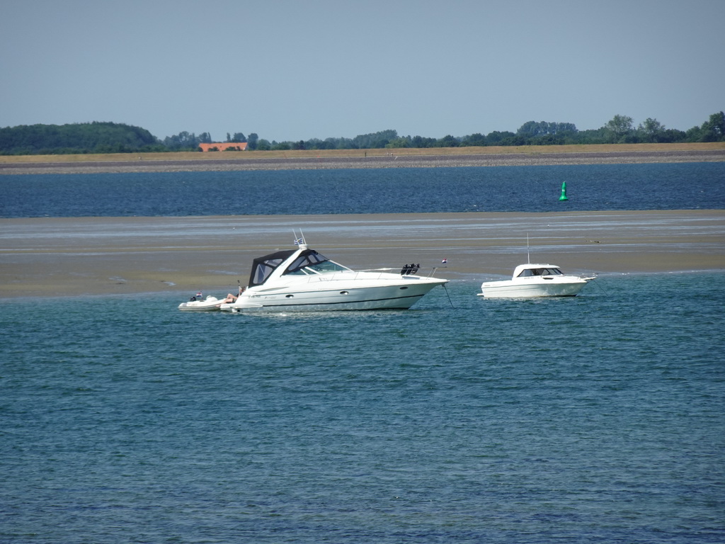 Boats at the National Park Oosterschelde, viewed from the beach near the Dijkweg road