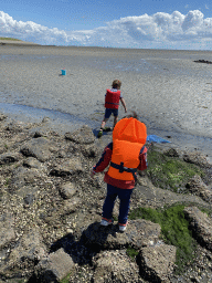 Max and his friend looking for seashells at the beach near the Dijkweg road