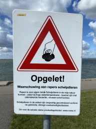 Warning sign for catching seashells at the beach near the Dijkweg road