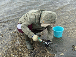 Miaomiao looking for seashells at the beach near the Dijkweg road