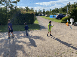 Max and his friend playing with a kite at the Oosterschelde Camping Stavenisse