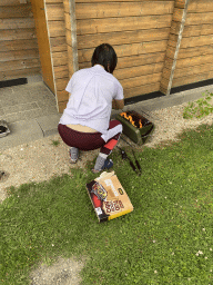 Miaomiao with the barbecue at terrace of the Stuurhut holiday home the Oosterschelde Camping Stavenisse