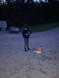 Max playing with a kite at the Oosterschelde Camping Stavenisse, at sunset